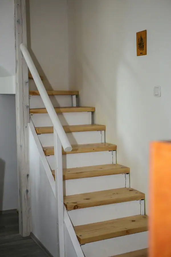 Wooden stairs to the upper floor of the villa