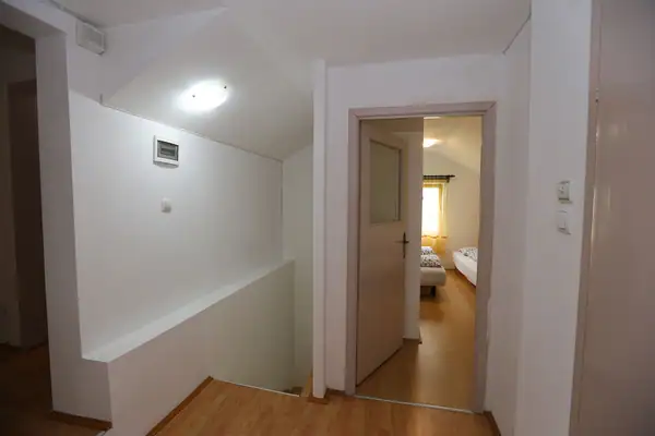Upstairs landing with a door to a bedroom