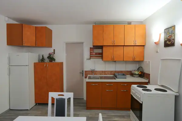 Well-equipped kitchen with a stove and worktop