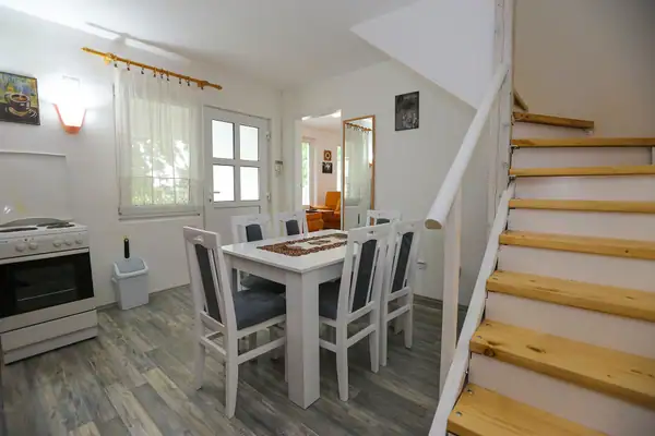 Dining area with a white table and chairs