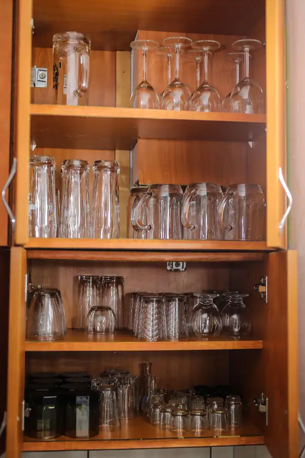 Glasses in a kitchen cabinet