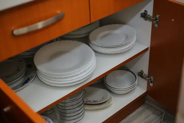 Plates in a kitchen cupboard