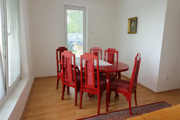 Dining table with red chairs