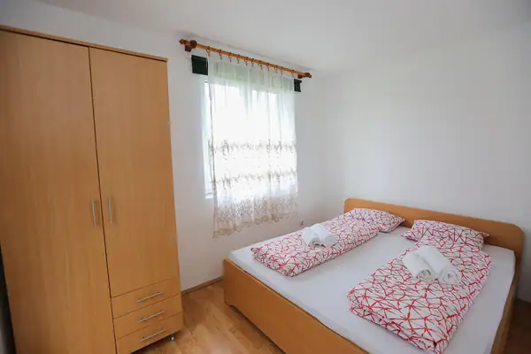 Bedroom with a double bed and wardrobe