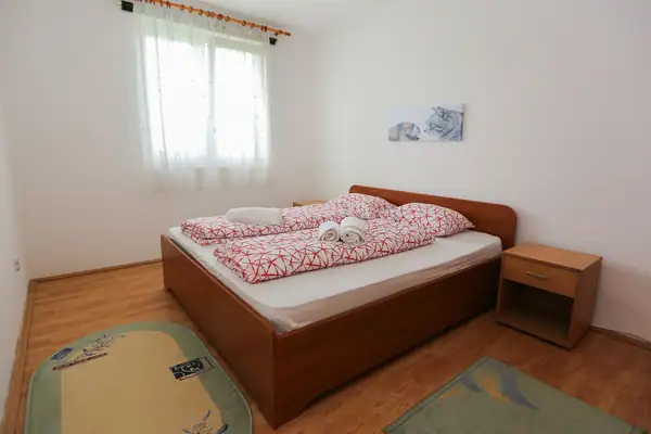 Bedroom with a wooden double bed