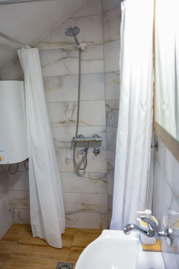 Bathroom with a shower and curtain