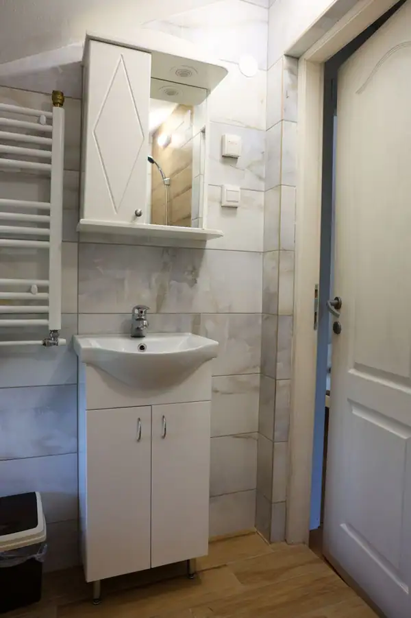 Bathroom with a washbasin and towel radiator