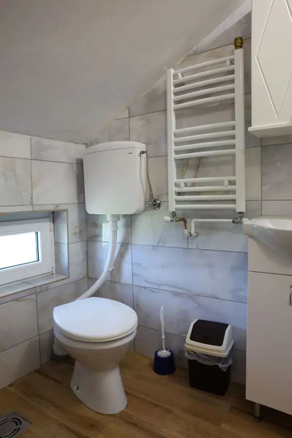 Attic bathroom with a towel radiator