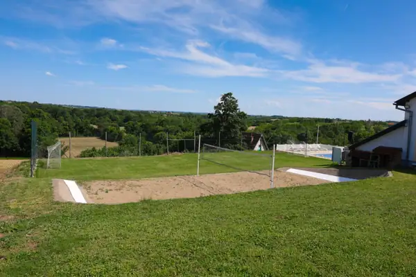 Beach volleyball court and lawn